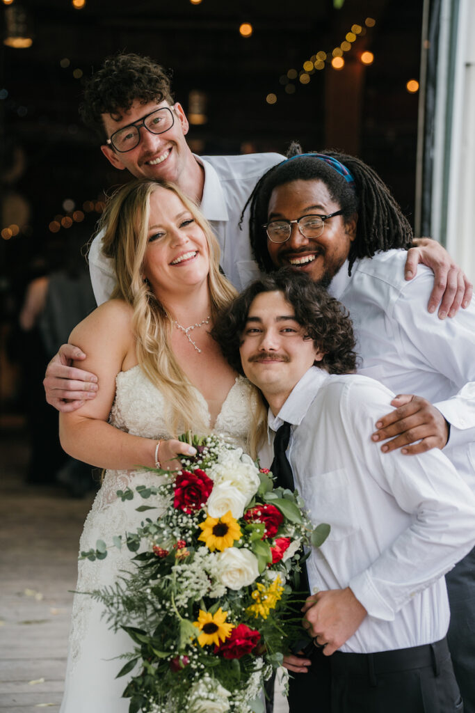 Group Wedding Portrait featuring a diverse Bridal Party